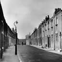 1955
 Pleasant Street in Preston, scene of a 'slum-clearance order'. On the right are four houses which have had a face lift