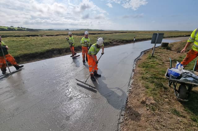 Workers undertaking the project at the Sunderland Point Causeway.