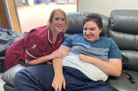 Paediatric nurse at Derian House Children's Hospice Suzanne Ward pictured with patient Leon has been awarded the prestigious title of Queen’s Nurse.
