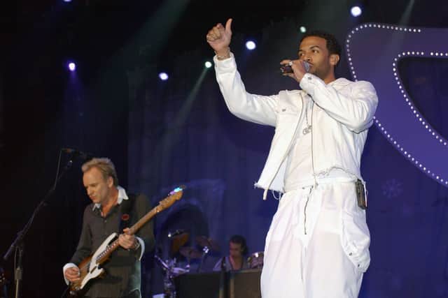 Craig David and Sting perform at the Capital FM's Christmas Live concert in aid of Help A London Child in December 2003. Credit: Steve Finn/Getty Images