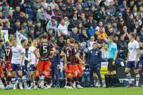 Referee Matthew Donahue shows Preston North End's Sam Greenwood the red card