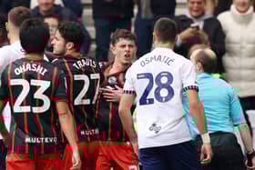 Owen Beck confronts Preston's Milutin Osmajic during Sunday's game at Deepdale