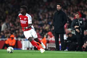 Mikel Arteta watches on