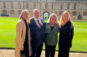 Coun Williams at Windsor Castle to receive her MBE, with her daughters Rosalyn (left) and Grace (right) and partner Patrick.