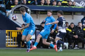 Josh Bowler flicks the ball through to Emil Riis