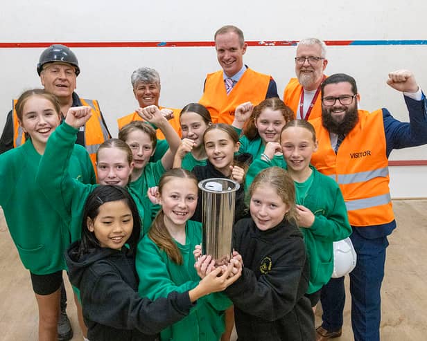 Pupils from Burscough Village Primary School, together with representatives from West Lancashire Borough Council and development partner Alliance Leisure, show off the time capsule they filled with their own artwork, which will now be buried during the Â£3.18m refurbishment of Burscough Sports.
