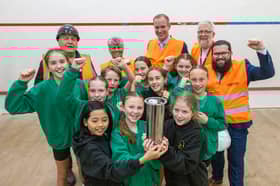 Pupils from Burscough Village Primary School, together with representatives from West Lancashire Borough Council and development partner Alliance Leisure, show off the time capsule they filled with their own artwork, which will now be buried during the Â£3.18m refurbishment of Burscough Sports.
