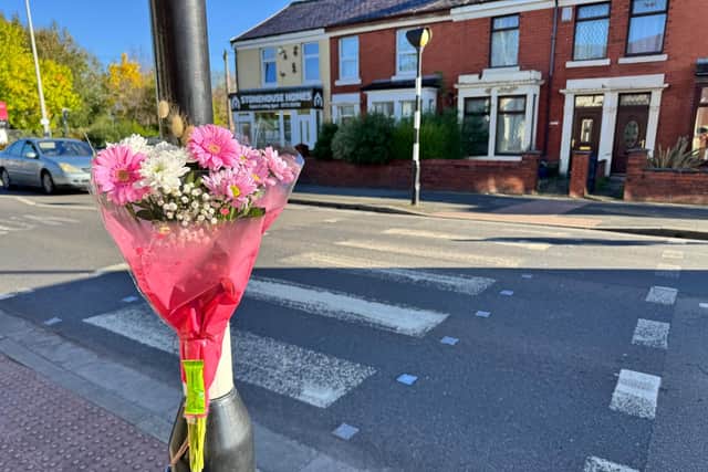 Floral tributes have been left at the zebra crossing in Station Road, Bamber Bridge - close to the junction with Longbrook Avenue and Fourfields - where a mum-to-be in her 30s was knocked down at around 7.50pm on Sunday, causing the death of her baby boy. Credit: Dave Nelson