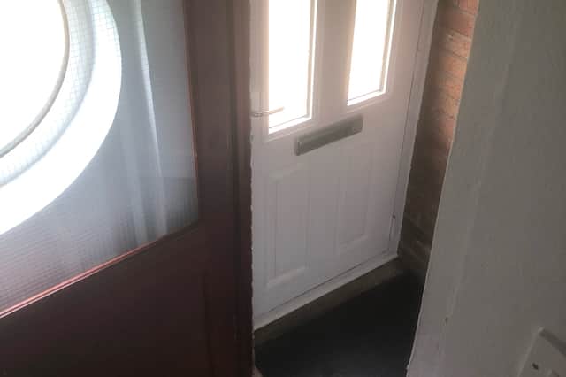 The door and staircase of the flat, where there is a sharp turn