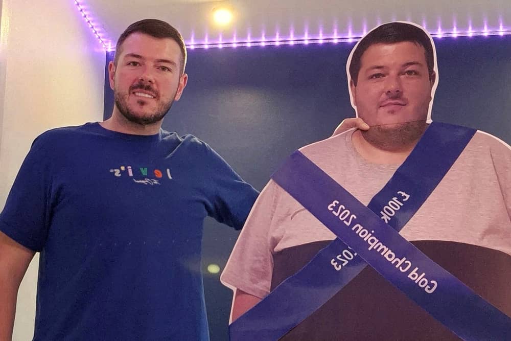 A former secret eater celebrated his 12 stone weight loss with a CARDBOARD CUT OUT showing his former XXXXL frame.
