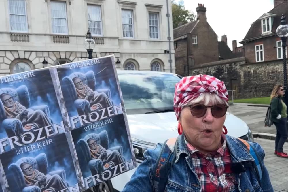 Protester speaks at winter fuel cuts rally.