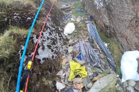 Video grab from heartbreaking footage showing 'waterfalls' of 3,000 bits of rubbish including drinks cans and Santa hats left by people on Mount Snowdon.