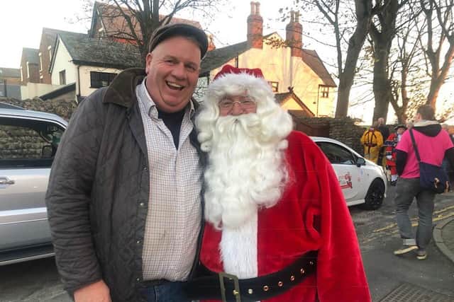 Pete Marquis, seen here with Santa, has delivered more than 2,000 Advent calendars to 15 primary schools in the Fylde area
