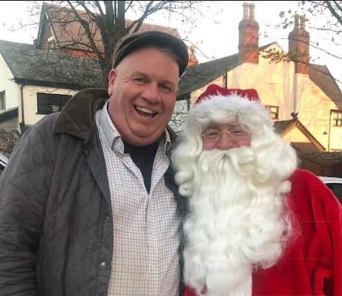 Pete Marquis, seen here with Santa, has delivered more than 2,000 Advent calendars to 15 primary schools in the Fylde area