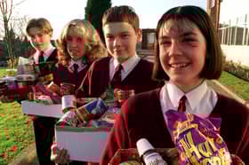 Chorley St Michael's High School year eight pupils, Matthew Leigh, Katy Clarke, Scott Kerr and Heather Green, with some of the goods collected by the school to be distributed to the needy this Christmas.  