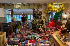 Picture shows landlady Jess Lucas with the donations for the Giftmas tree.