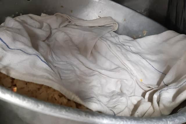 There were risks of contamination of food and surfaces from flies, dirty cloths covering food, as well as food stored in bin liners and plates stored under the fly killer.
