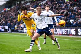 Ali McCann is challenged by Ao Tanaka 