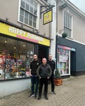 Happy Piranha store owner Martin Gaunt (centre) outside his store with sons Sam and Josh. 