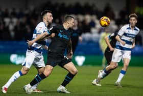 Milutin Osmajic (centre) keeps his eye on the ball 