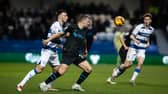 Milutin Osmajic (centre) keeps his eye on the ball 