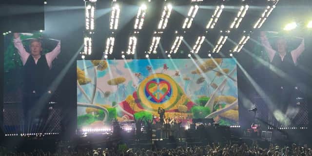 Paul McCartney takes a bow at the end of his December 14 show in Manchester.