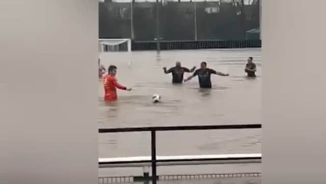 Lydney Town AFC players swim in flooded pitch