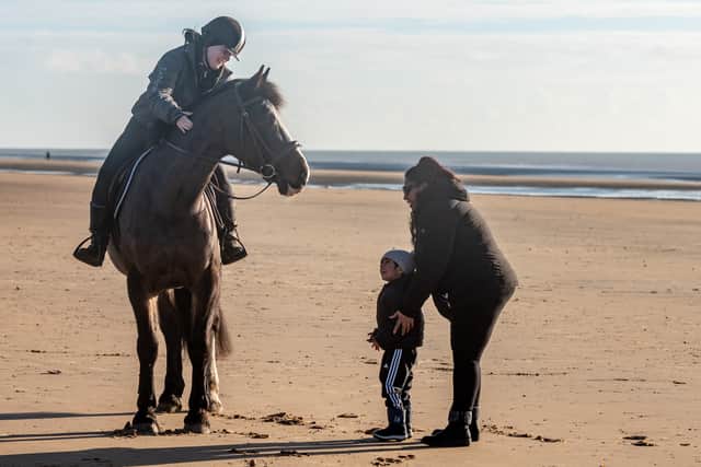 Tahir Mehmood, serial staycationer, at one of the 13 destinations he's been to in the past 12 months, Camber Sands