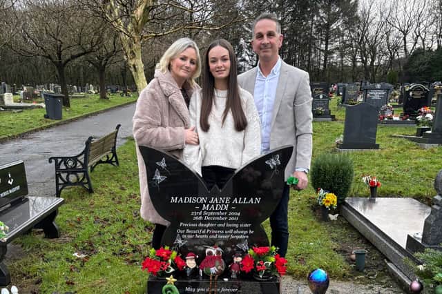 Sam, Scarlett and Mark at Madison's grave