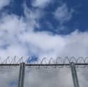 Drones dropping drugs and weapons to dangerous prisoners being held in high-security jails are a "threat to national security", a watchdog has warned