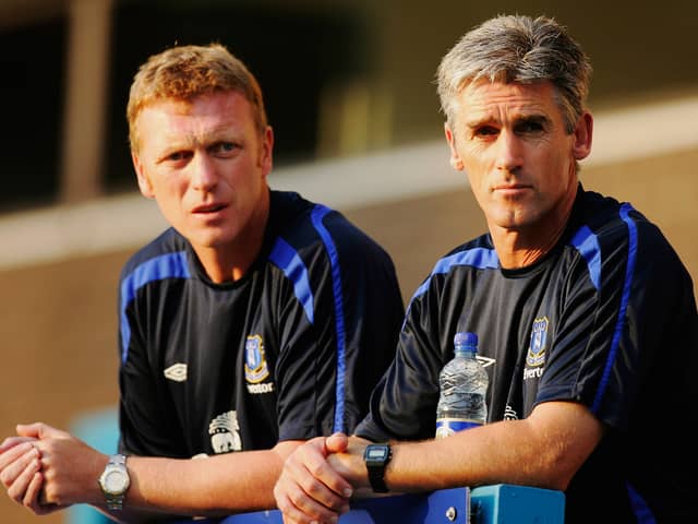 Alan Irvine (right) looks on with David Moyes (left) during the friendly match between Preston North End and Everton at Deepdale on July 19, 2006