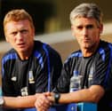Alan Irvine (right) looks on with David Moyes (left) during the friendly match between Preston North End and Everton at Deepdale on July 19, 2006