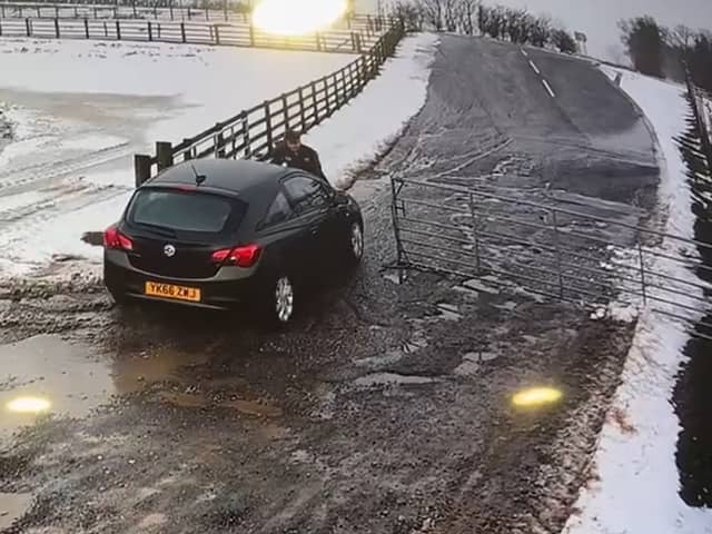 The moment Alan Lewis drove off with the staff member on the bonnet of the car. Credit: Mainsgill Farm Shop
