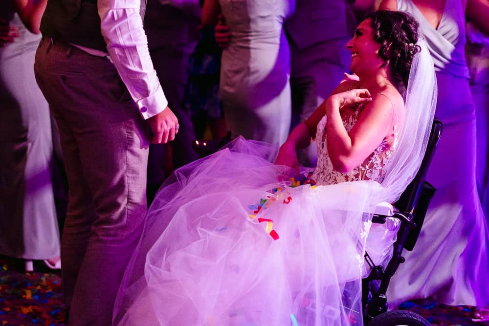 A bride given less than six months to live after losing her leg to cancer made it down the aisle to marry her partner -for the second time. 