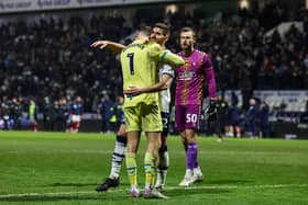 Preston North End's Ched Evans celebrates with Freddie Woodman after scoring the winning penalty