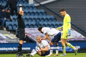 Preston North End's Jack Whatmough goes down injured