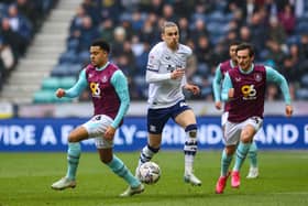 Preston North End's Brad Potts vies for possession with Burnley's CJ Egan-Riley