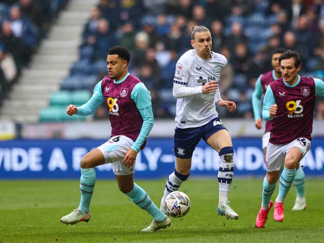 Preston North End's Brad Potts vies for possession with Burnley's CJ Egan-Riley