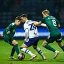 Preston North End's Sam Greenwood battles with Millwall's Billy Mitchell