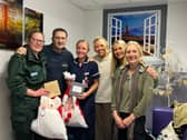 Ian with family and medics