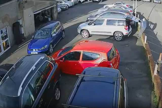 Man falls through an unsafe wall at car dealership