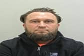 James Thompson is wanted by police after a driver was “threatened with an axe” following a crash on the M6