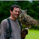 The missing owl with its handler