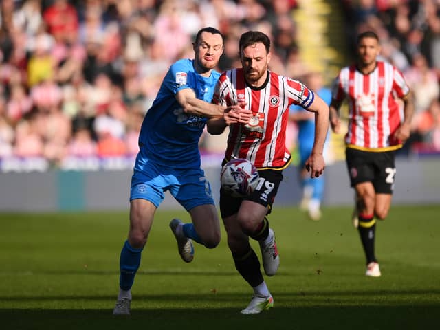 Jack Robinson of Sheffield United is challenged 