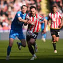 Jack Robinson of Sheffield United is challenged 