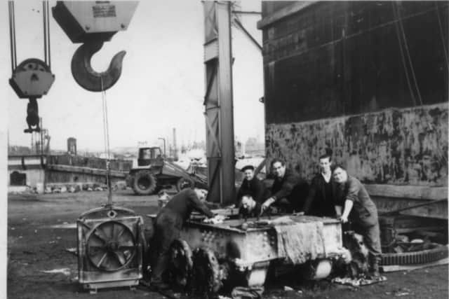Penwortham reader Carole Dickinson tells us her father is on the far left of this picture taken on Preston Docks