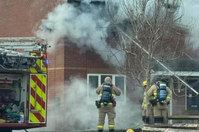 Firefighters tackle the blaze.