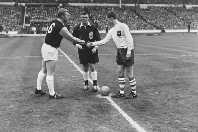 Bobby Moore and Nobby Lawton shake hands before the kick off of their FA Cup Final match on 2nd May 1964