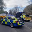 Two men have been arrested after a female police officer was violently attacked in Great Harwood