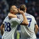 Milutin Osmajic celebrates with Will Keane